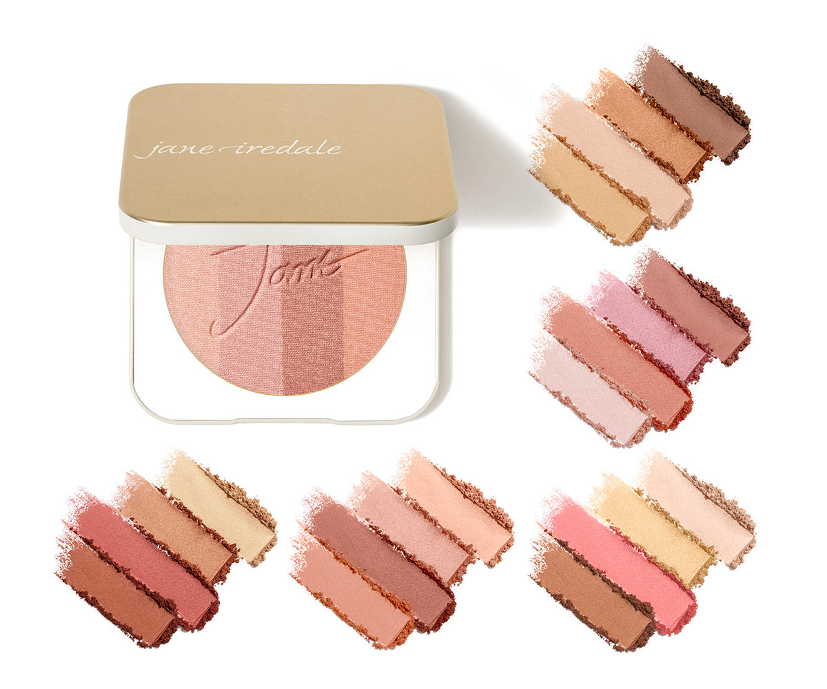 Eine Jane Iredale Bronzer-Puderdose mit goldfarbenem Deckel und schimmerndem, mehrfarbigem Puder; umgeben von fünf Gruppen mit schimmernden Puder-Swatches in verschiedenen Gold-, Rosé- und Kupfertönen auf weißem Grund.